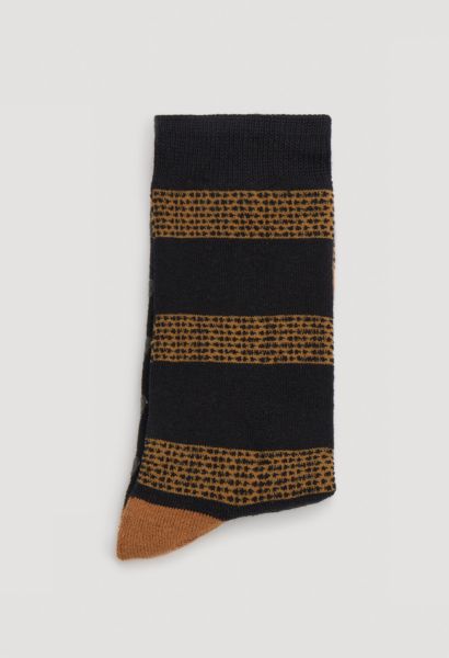 Εικόνα της Ysabel Mora μαύρες κάλτσες με πατουσάκια σιλικόνης και σχέδιο λιοντάρι.